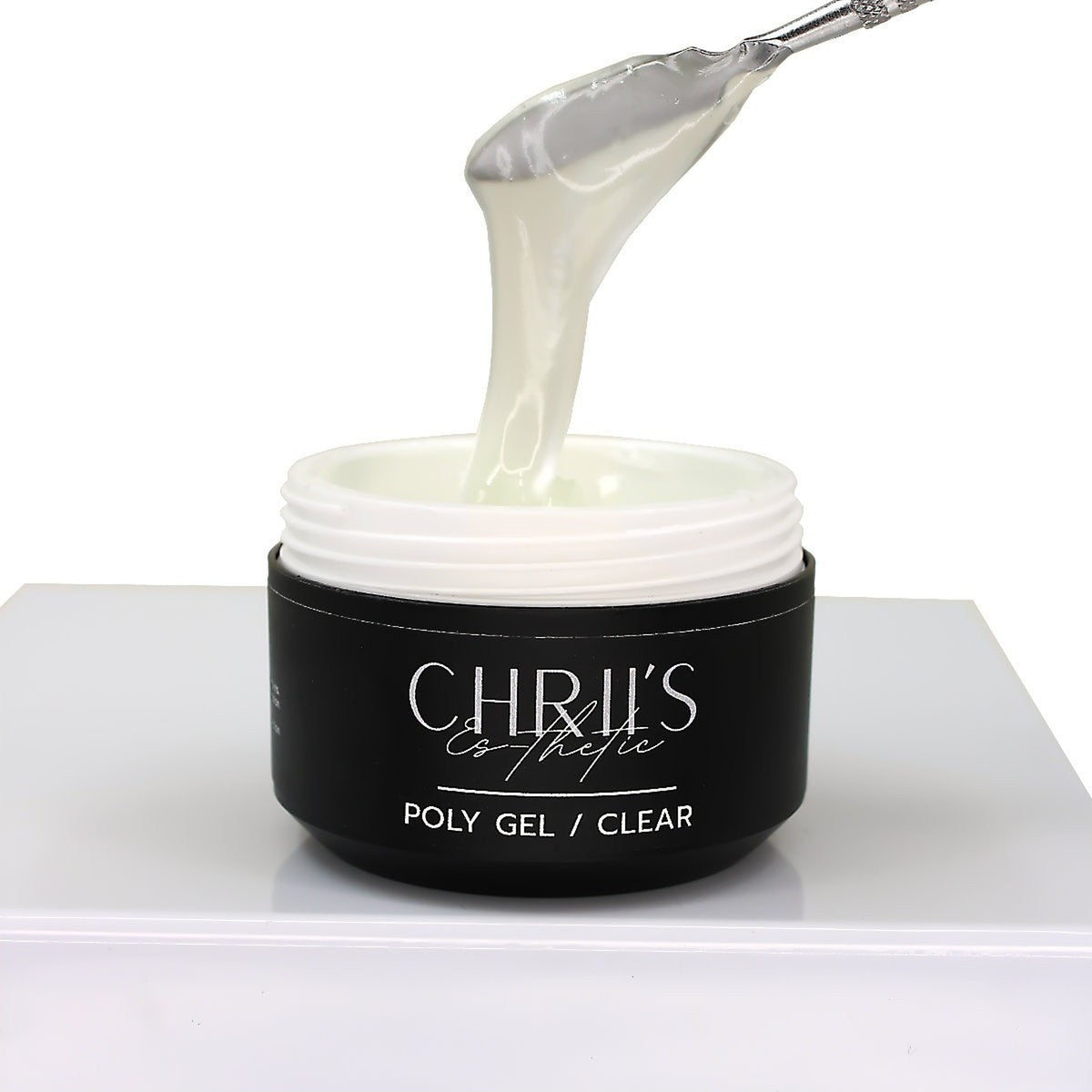 Polygel Clear CHRIIS‑ESTHETIC prélevé dans son pot, montrant sa transparence, chez mon style mes ongles