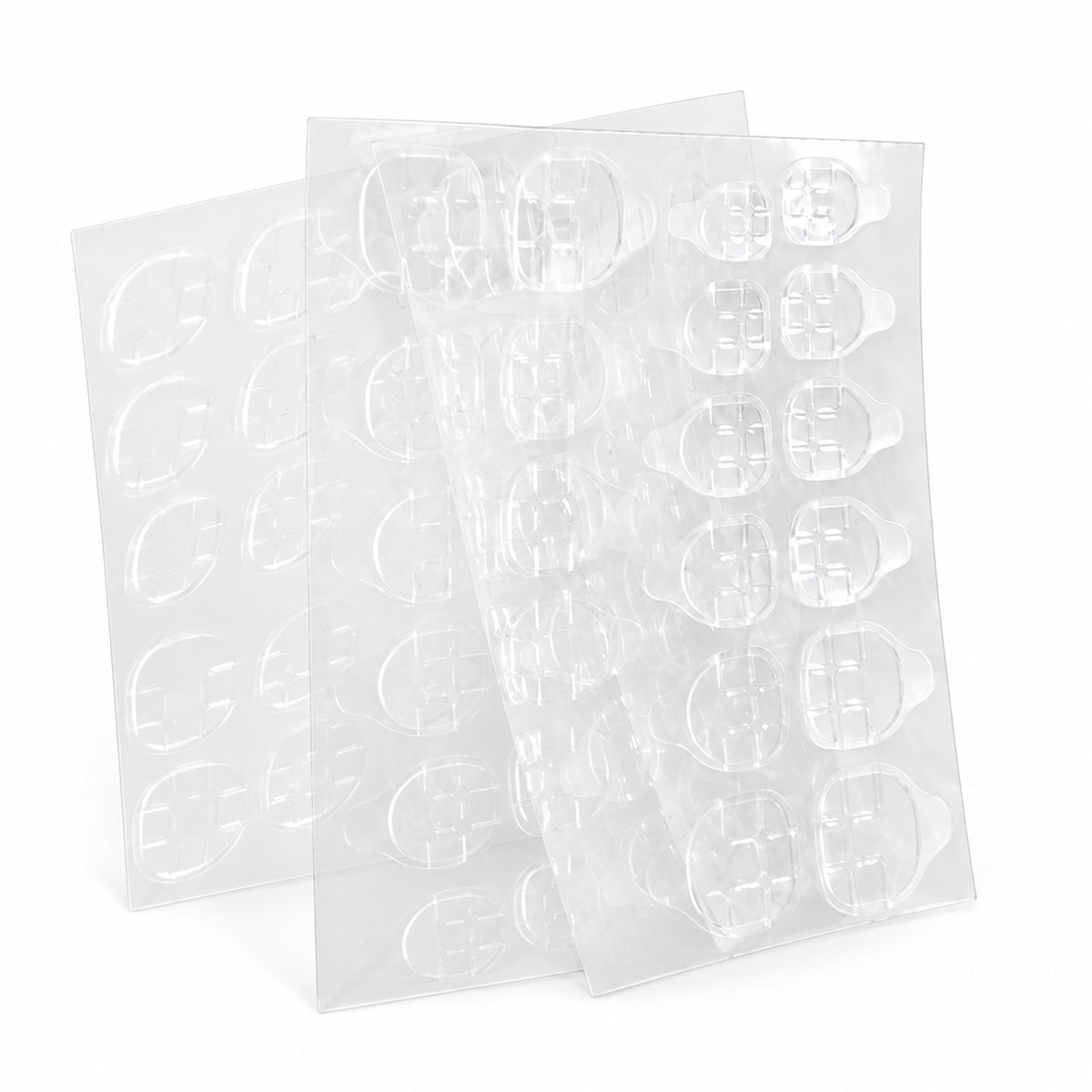 Planche de pastilles adhésives double face pour fixer des ongles réutilisables ou press-on.