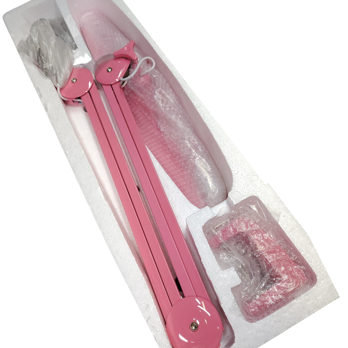 Lampe LED articulée rose et ses accessoires dans leur emballage.