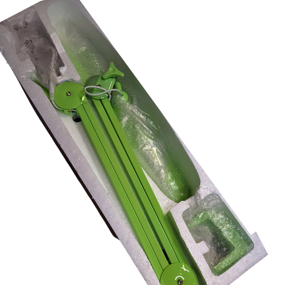 Lampe LED articulée verte et ses accessoires dans leur emballage.