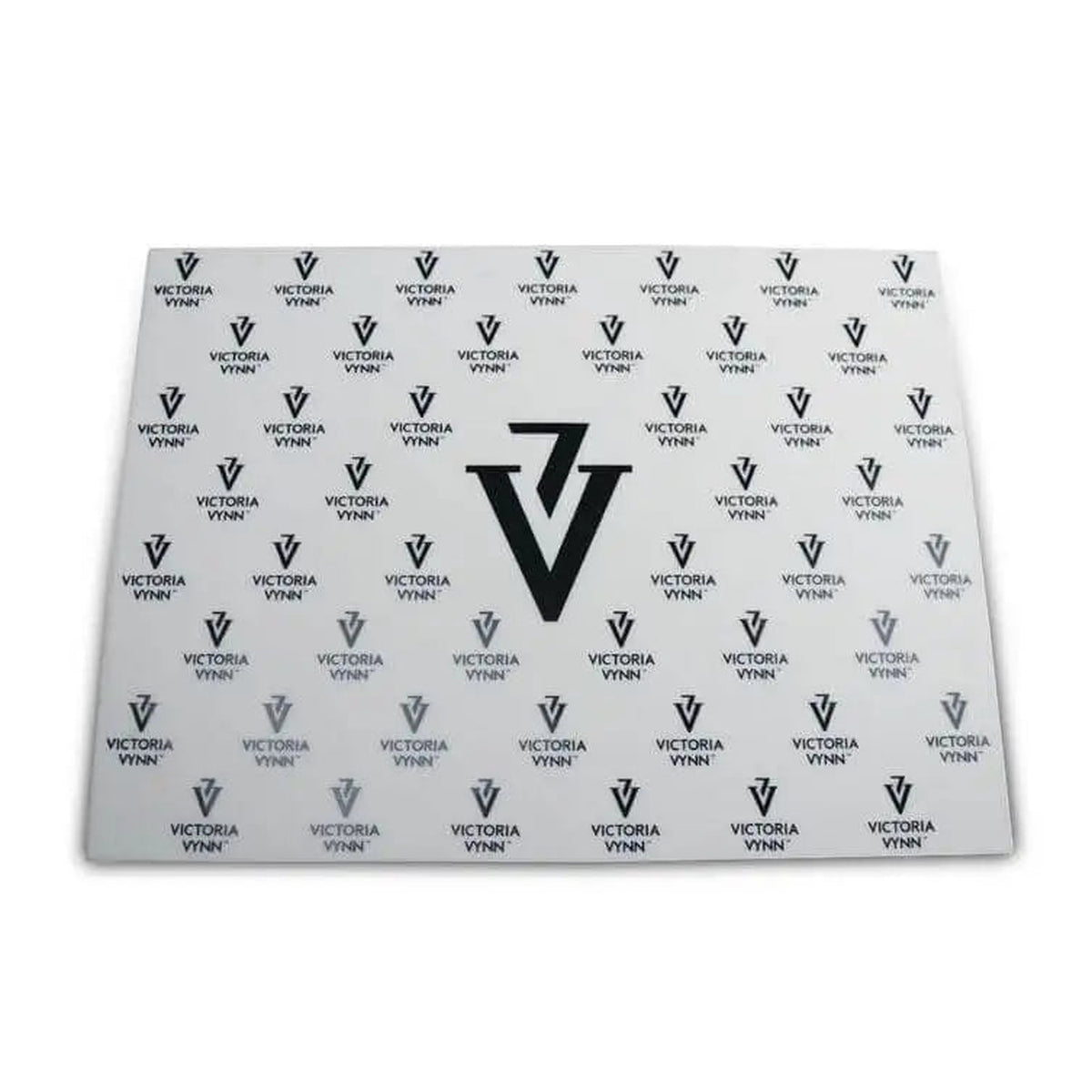 Tapis de manucure en silicone Victoria Vynn blanc, vue à plat avec logo central.